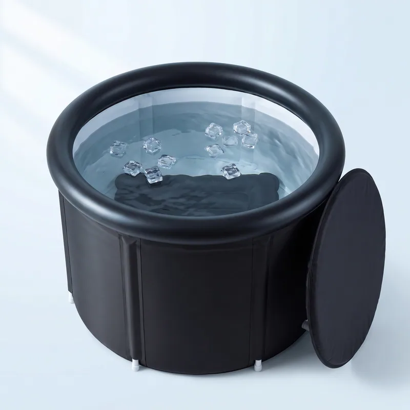 The Ice Bath Tub seen from above without its lid, filled with clear water and ice cubes, the seat cushion under the water and the lid leaning on its side