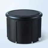 The black, round Ice Bath Tub with its insulated lid