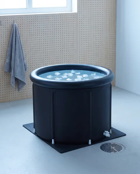 The Ice Bath Tub set up in a garage, near a floor drain